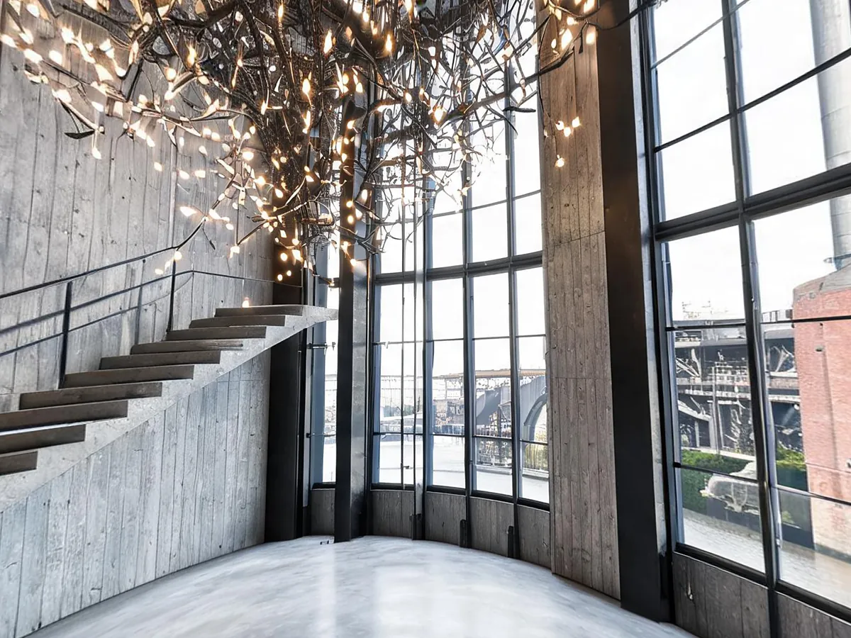Concrete museum atrium with a light sculpture